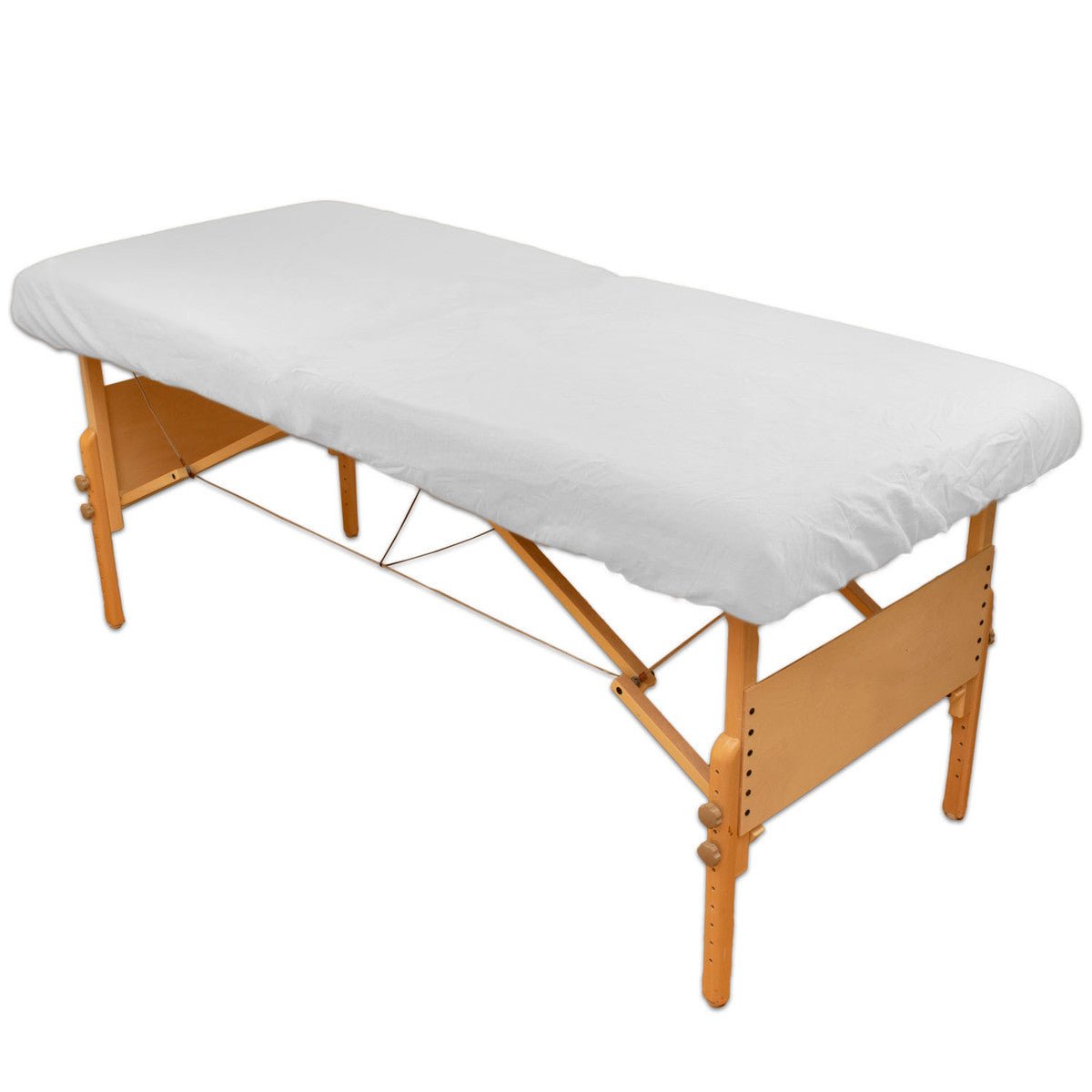 White flannel fitted sheet on a massage table | Equip Wellness Collective